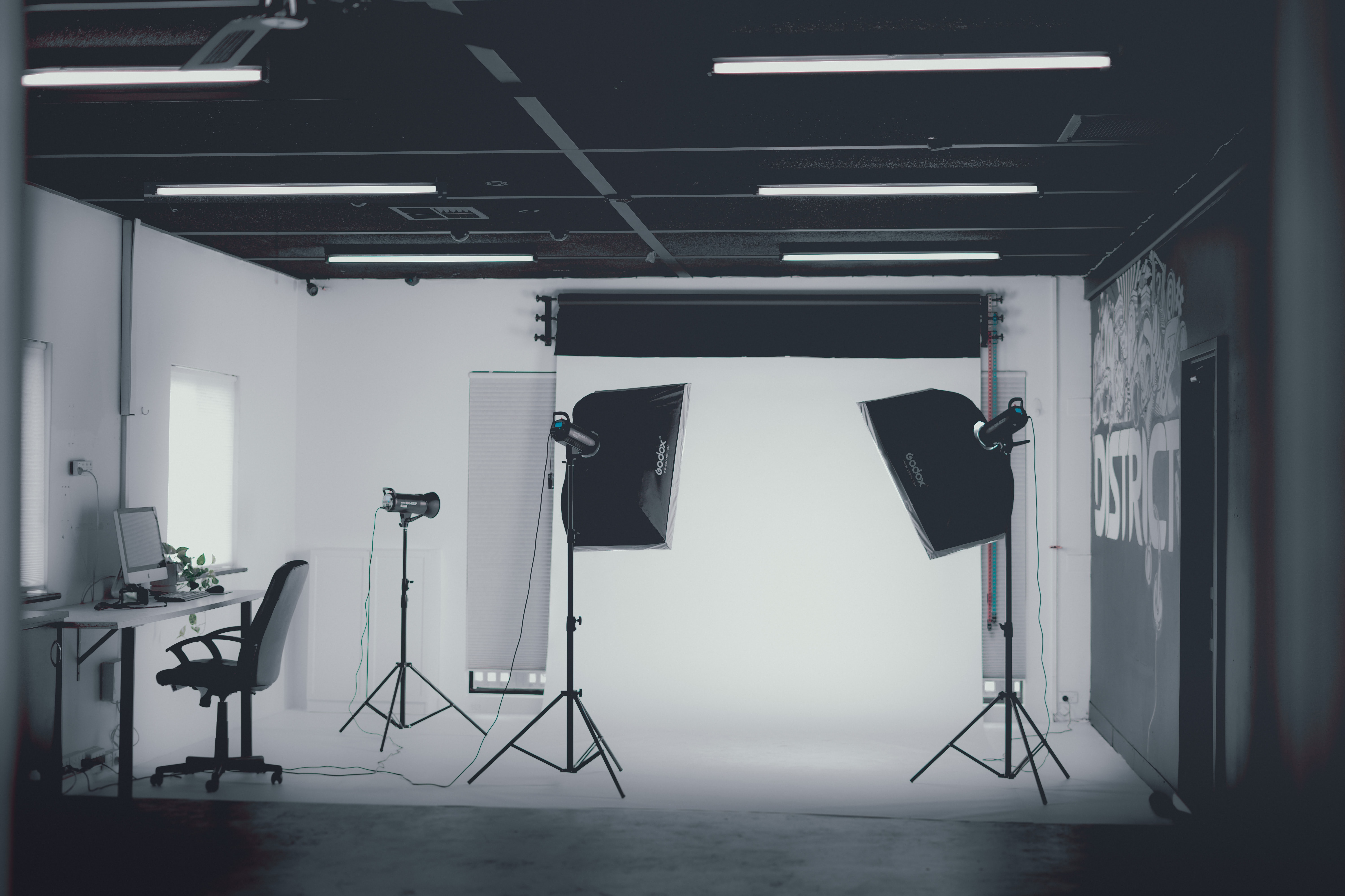 A home studio with a professional camera and gigantic softbox lights.