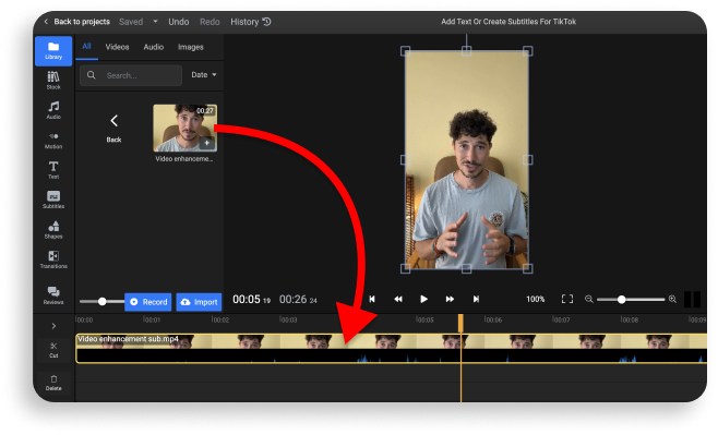 A picture showing users how to drag their video to the timeline at the bottom of the screen.